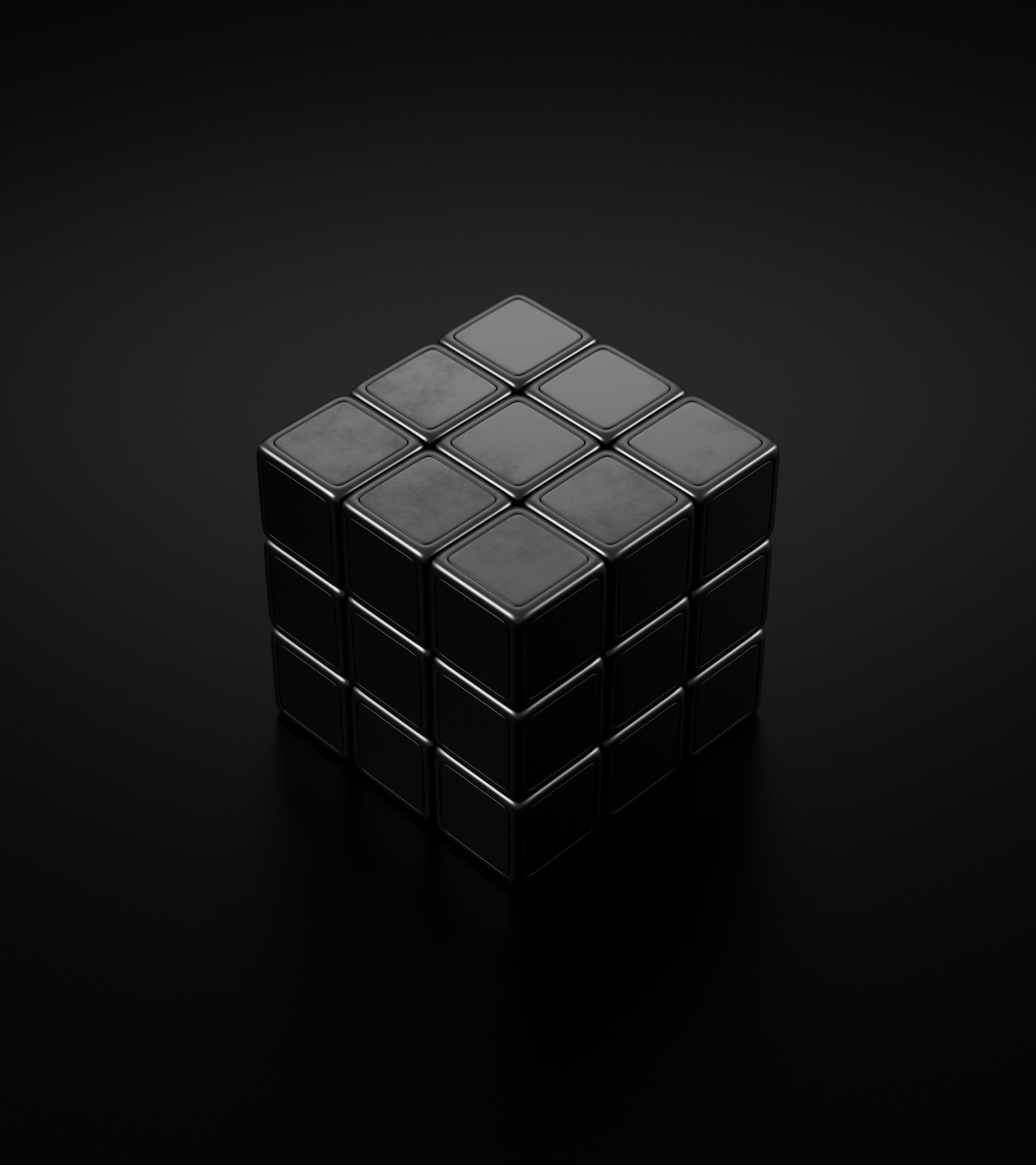 3D render: a black puzzle cube on a dark ground